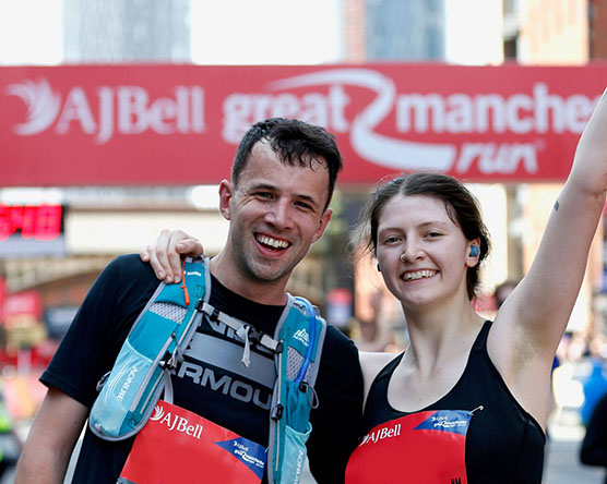 Happy runners at Manchester finish line
